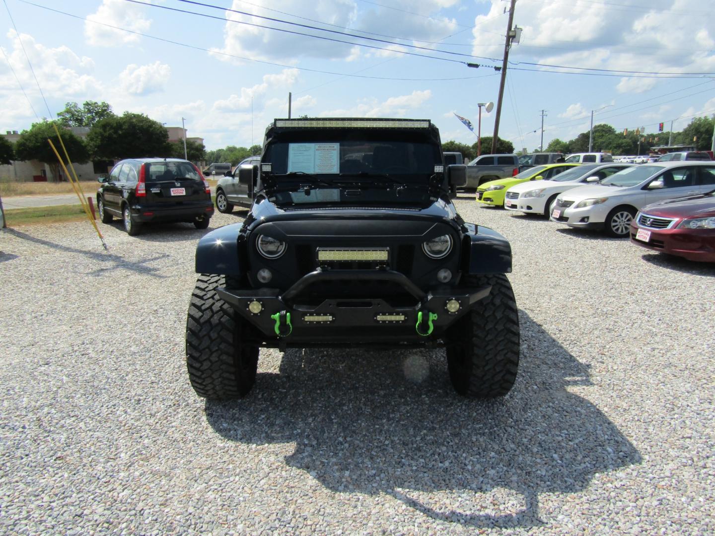 2015 Black /Tan Jeep Wrangler (1C4HJWEG4FL) with an V6 engine, Automatic transmission, located at 15016 S Hwy 231, Midland City, AL, 36350, (334) 983-3001, 31.306210, -85.495277 - Photo#1